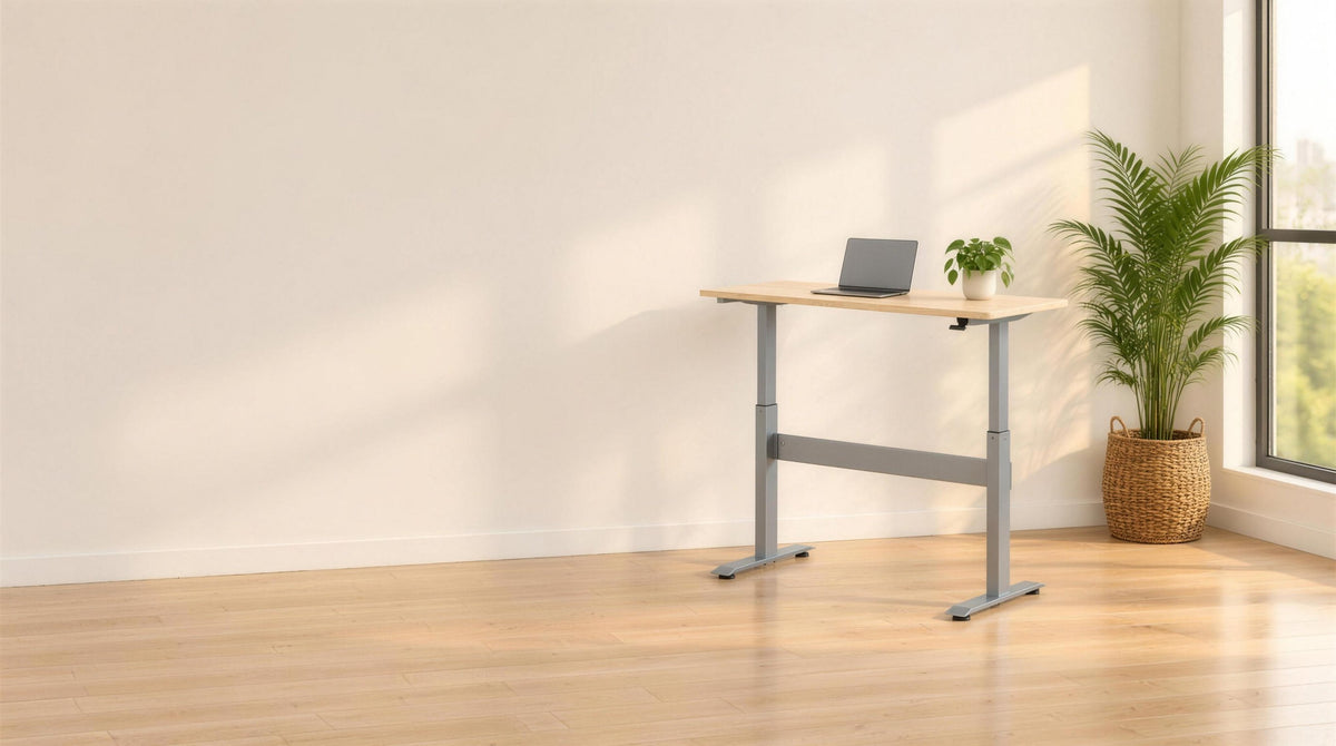 Featherlite Airlift height adjustable desk raised to standing height by a window