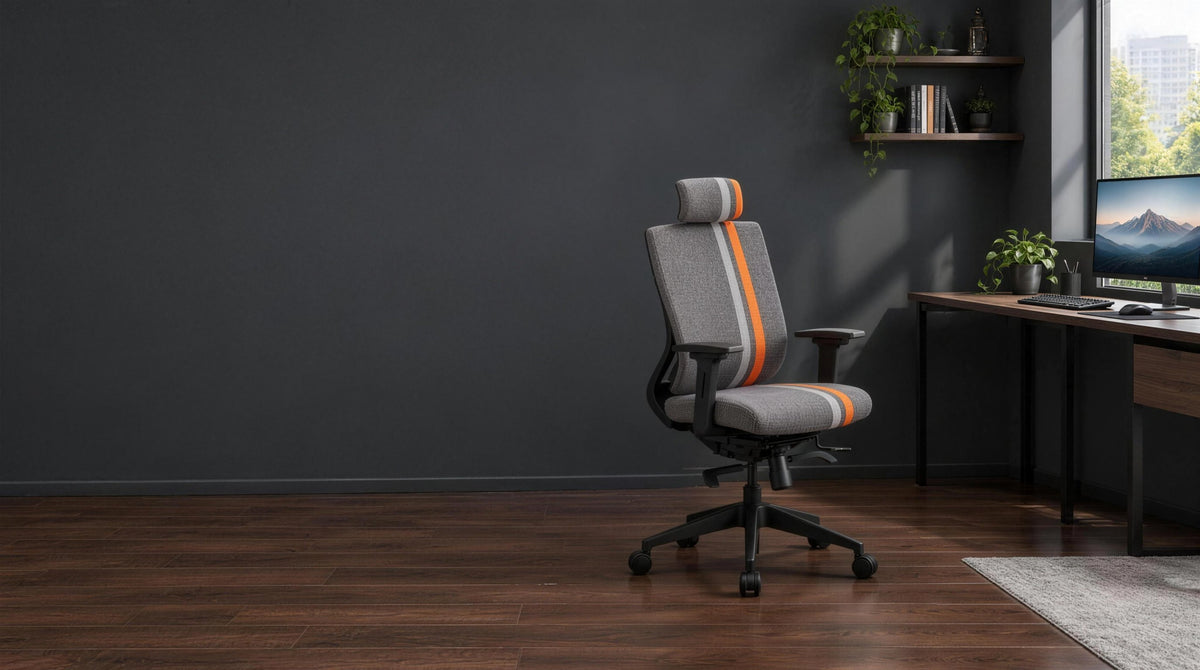 Featherlite Liberate Game fabric gaming chair in orange and grey at a dark desk